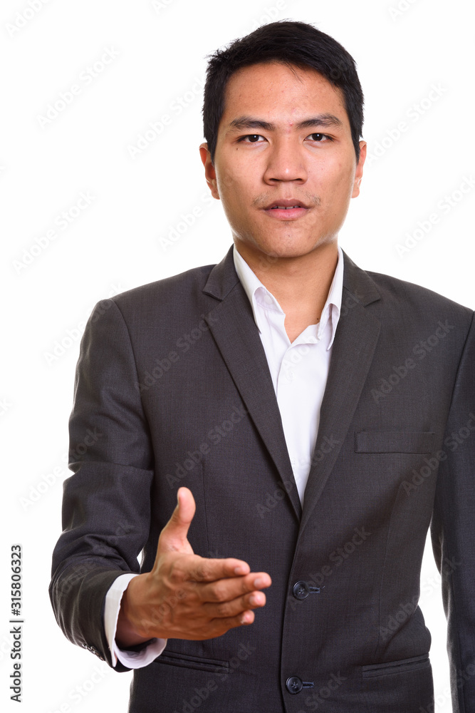 Close up of young Asian businessman giving handshake Close up of young Asian businessman giving handshake