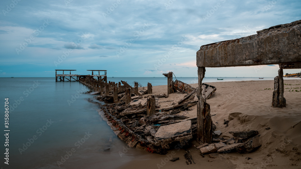 Dilapidated old fishing dock collapsing into the sea in Pak Nam Pran Thailand