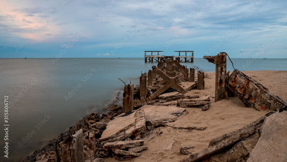 Dilapidated old fishing dock collapsing into the sea in Pak Nam Pran Thailand Dilapidated old fishing dock collapsing into the sea in Pak Nam Pran Thailand