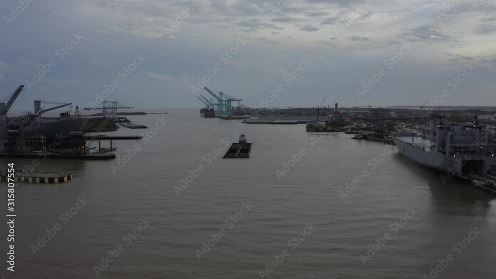 Barge and Pushboat pushing through Port of Mobile in Alabama Barge and Pushboat pushing through Port of Mobile in Alabama