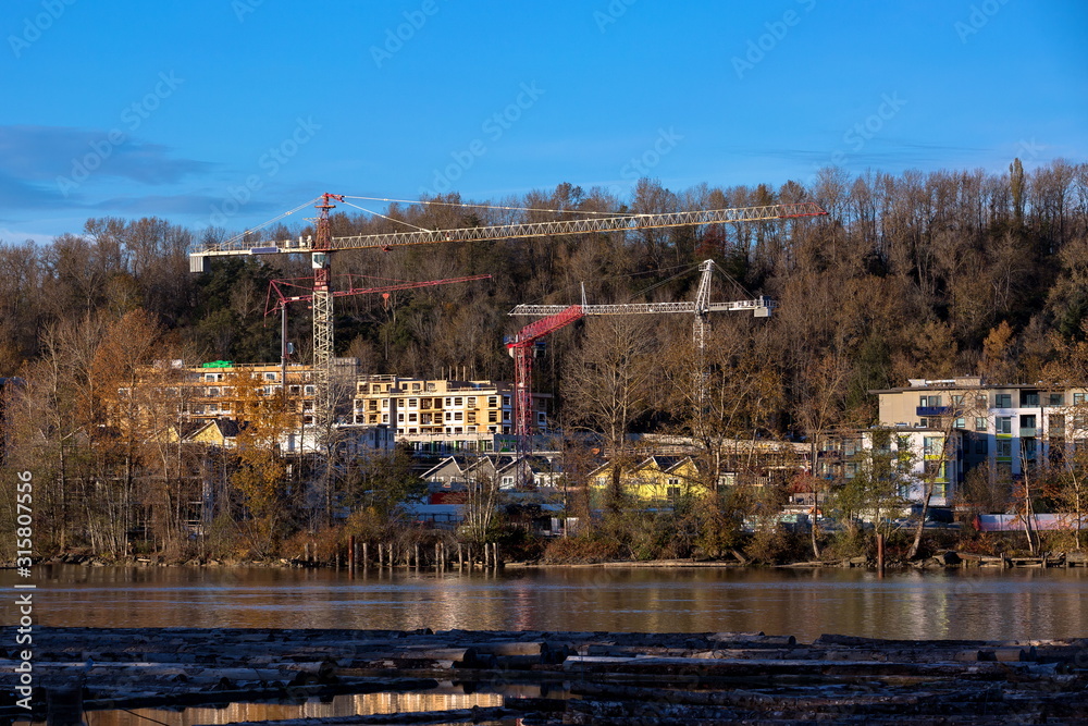 Construction of a new residential area on the banks of the Fraser River in Vancouver City