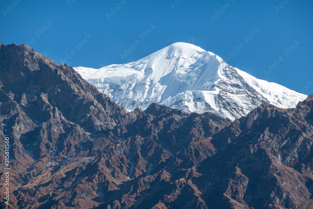 Snow Covered Peaks and Rugged Terrain