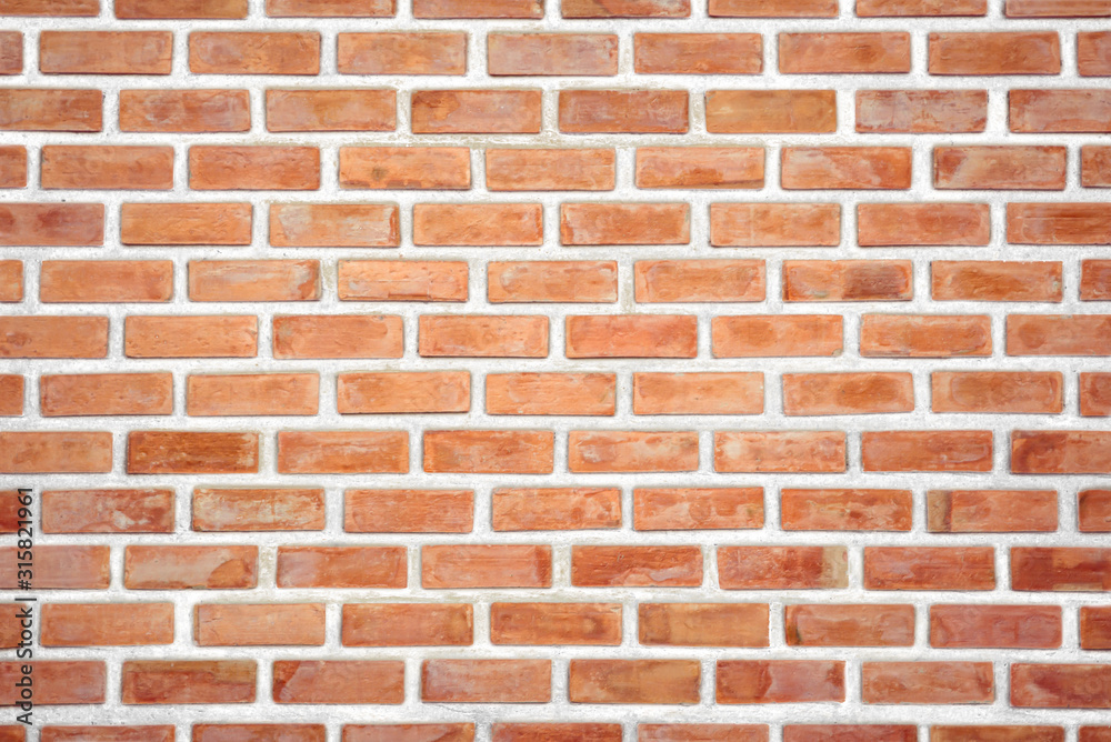 Old Orange brick wall concrete or stone texture background, wallpaper limestone abstract to flooring and homework/Brickwork or stonework clean grid uneven interior rock old. Copy space. Old Orange brick wall concrete or stone texture background, wallpaper limestone abstract to flooring and homework/Brickwork or stonework clean grid uneven interior rock old. Copy space.