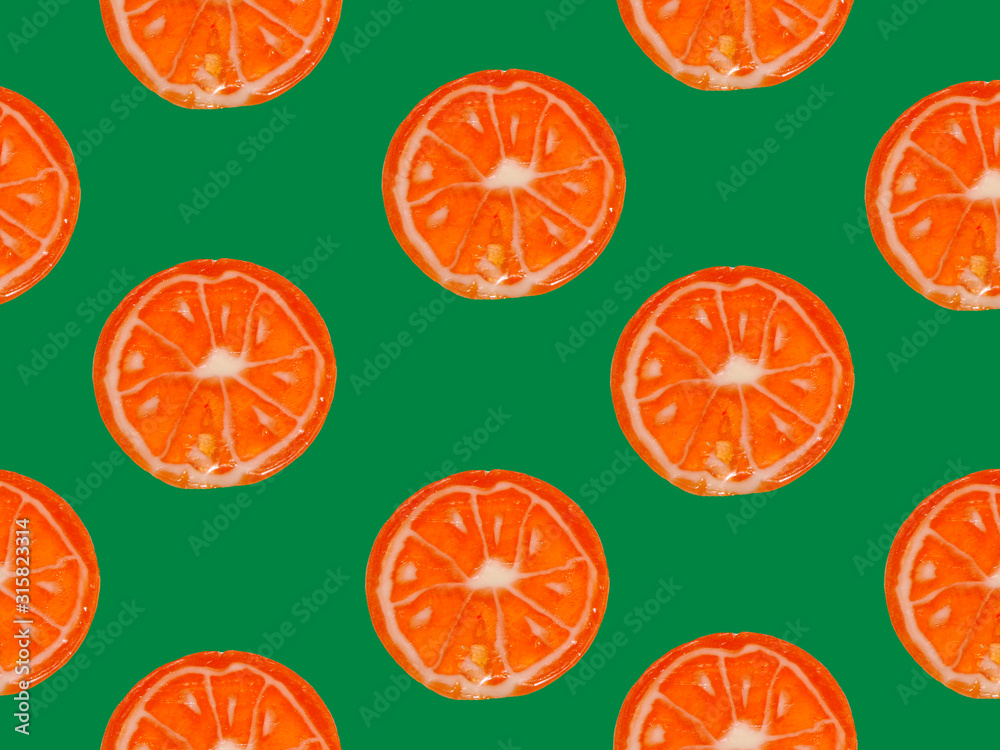 Seamless pattern with orange citrus slices on a green background. Seamless pattern with orange citrus slices on a green background.