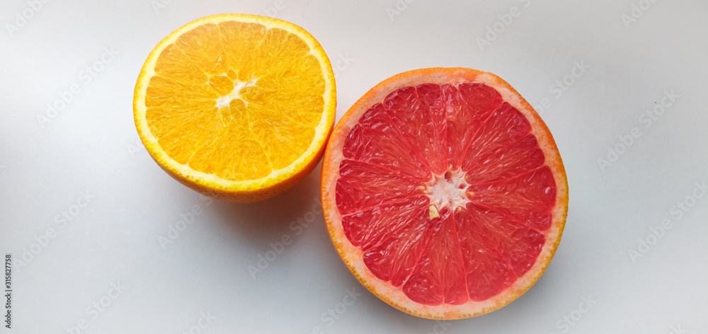 cutaway orange and grapefruit on a white background cutaway orange and grapefruit on a white background