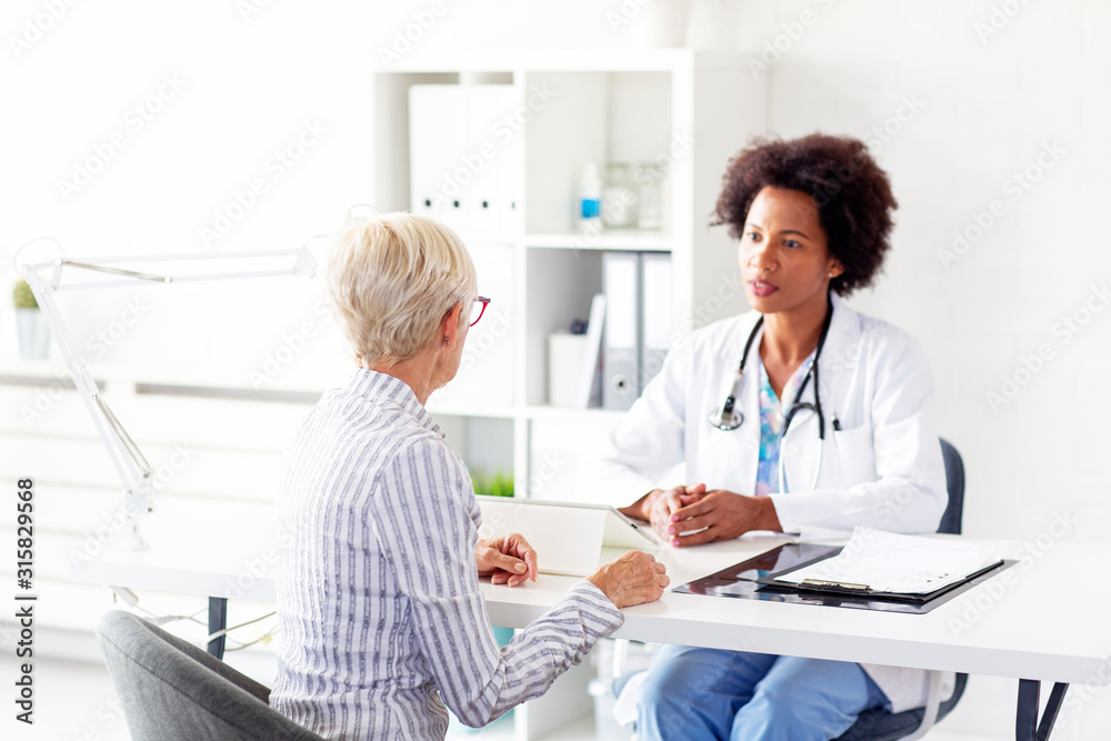 older woman in ambulance with her doctor on medical treatment older woman in ambulance with her doctor on medical treatment