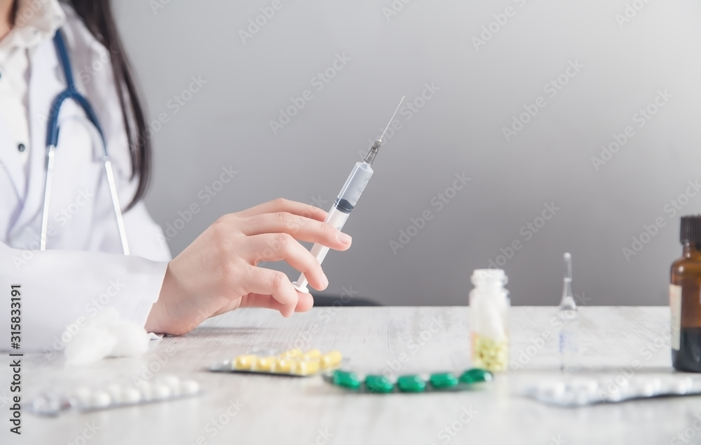 Doctor holding syringe. Healthcare and medical