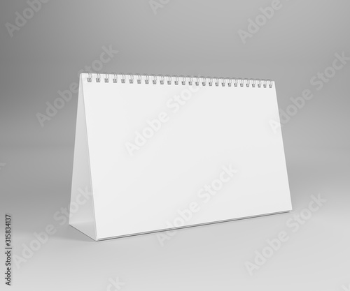 Blank standing paper desk spiral calendar. Isolated on white background. 3D