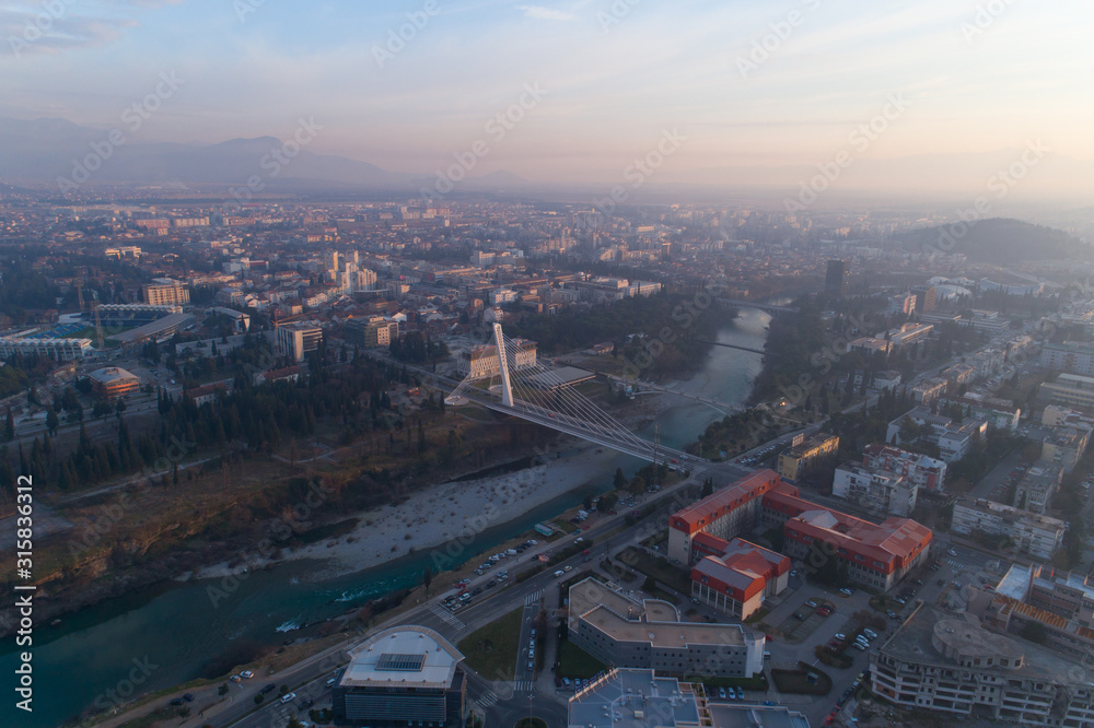 Fototapeta premium aerial view of Millennium bridge over Moraca river in Podgorica