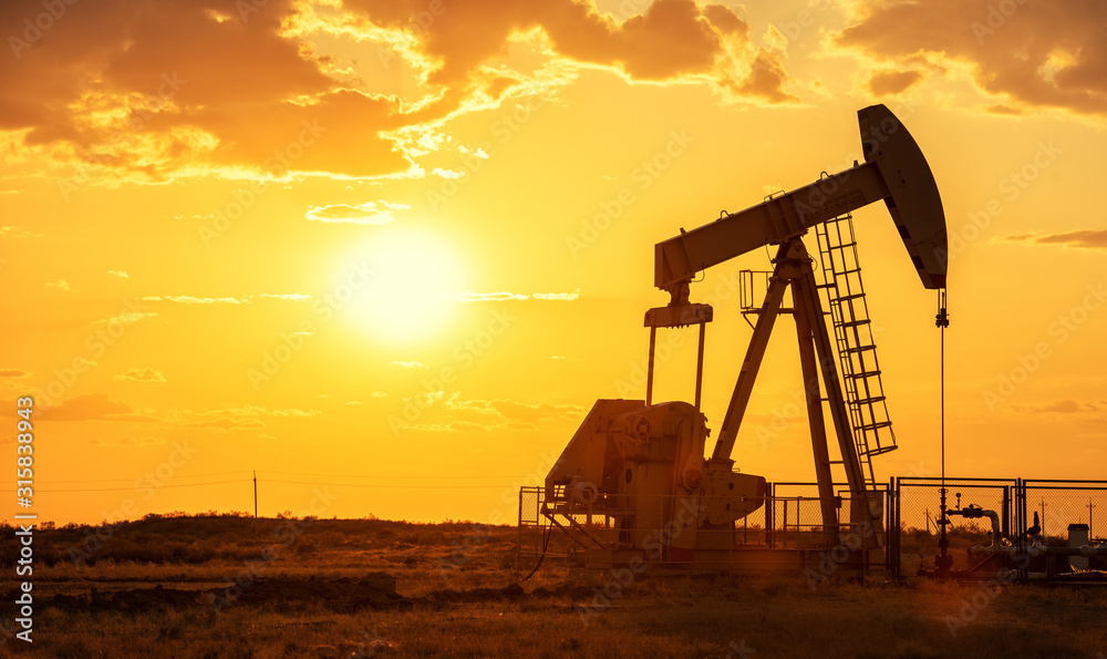 Oil pump oil rig energy industrial machine for petroleum in the sunset background - obrazy, fototapety, plakaty 