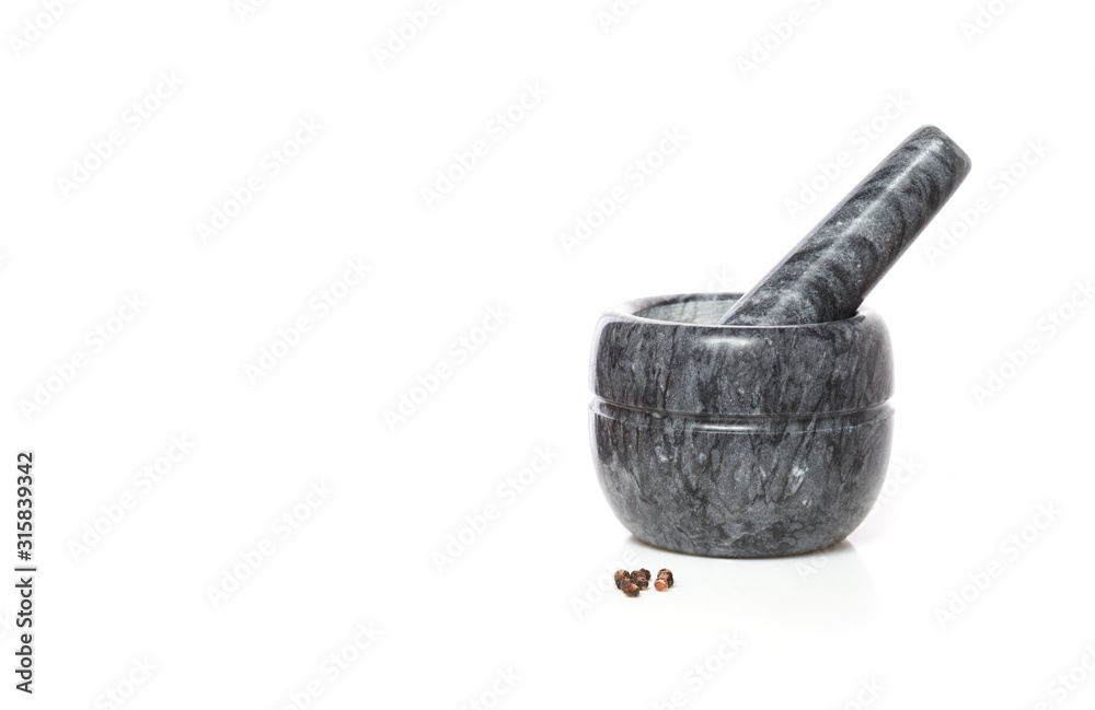 Marble mortar with pestle and black pepper peas isolated on a white background Marble mortar with pestle and black pepper peas isolated on a white background