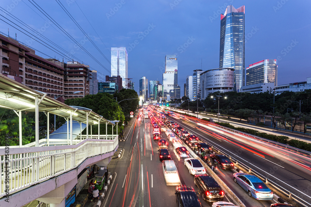 Rush hour in Jakarta business district in Indonesia capital city with traffic captured with blurred motion Rush hour in Jakarta business district in Indonesia capital city with traffic captured with blurred motion