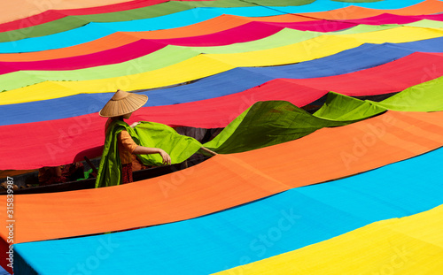 Fototapeta Handcrafted colorful lotus fabrics made from lotus fibers in Inle Lake, Shan State in Myanmar