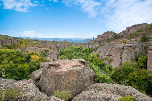 Beautiful landscape with bizarre rock formations. Stone stairs leading to the amazing rock formations and walls of a medieval fortress in Belogradchik, northwest Bulgaria. Panorama 