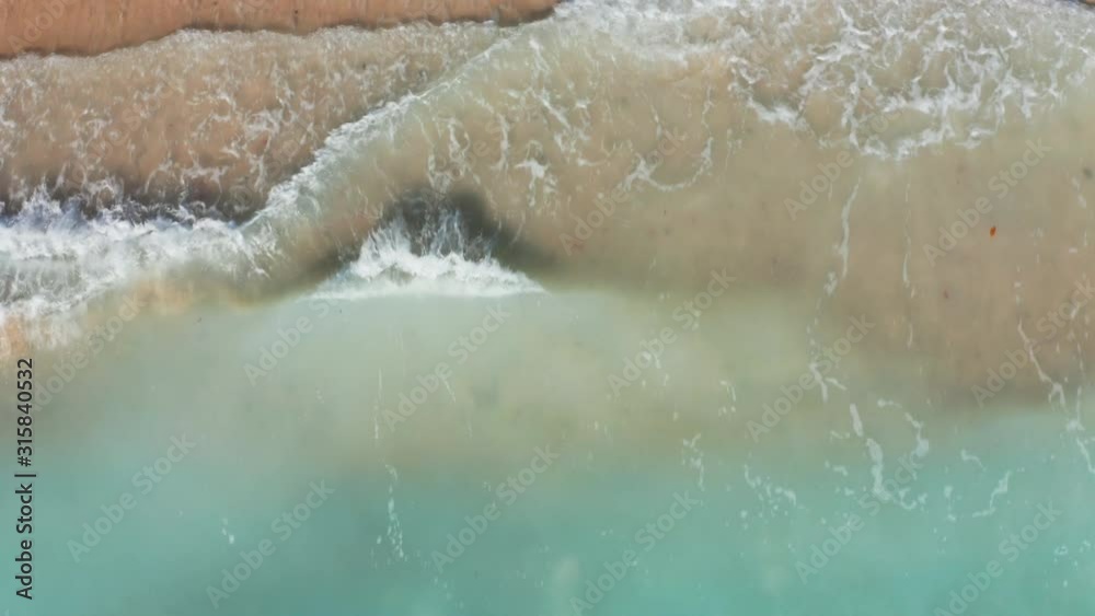Big Waves rolling from above. Top down 4k drone view on blue turquoise ocean, breaking waves, whitewash. Sunny day over the sea. Huge swell hitting shoreline. Powerful waves Oahu, Hawaii North Shore Big Waves rolling from above. Top down 4k drone view on blue turquoise ocean, breaking waves, whitewash. Sunny day over the sea. Huge swell hitting shoreline. Powerful waves Oahu, Hawaii North Shore