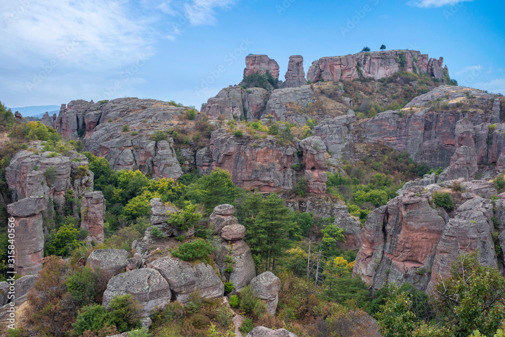 Beautiful landscape with bizarre rock formations. Stone stairs leading to the amazing rock formations and walls of a medieval fortress in Belogradchik, northwest Bulgaria. Panorama	