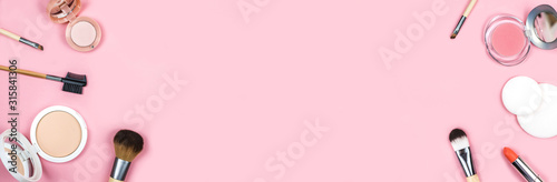 Banner made from set of decorative cosmetics for make up on pink background. Copy space, flat lay.