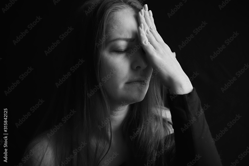 headache and depression, black and white portrait of a tired woman headache and depression, black and white portrait of a tired woman