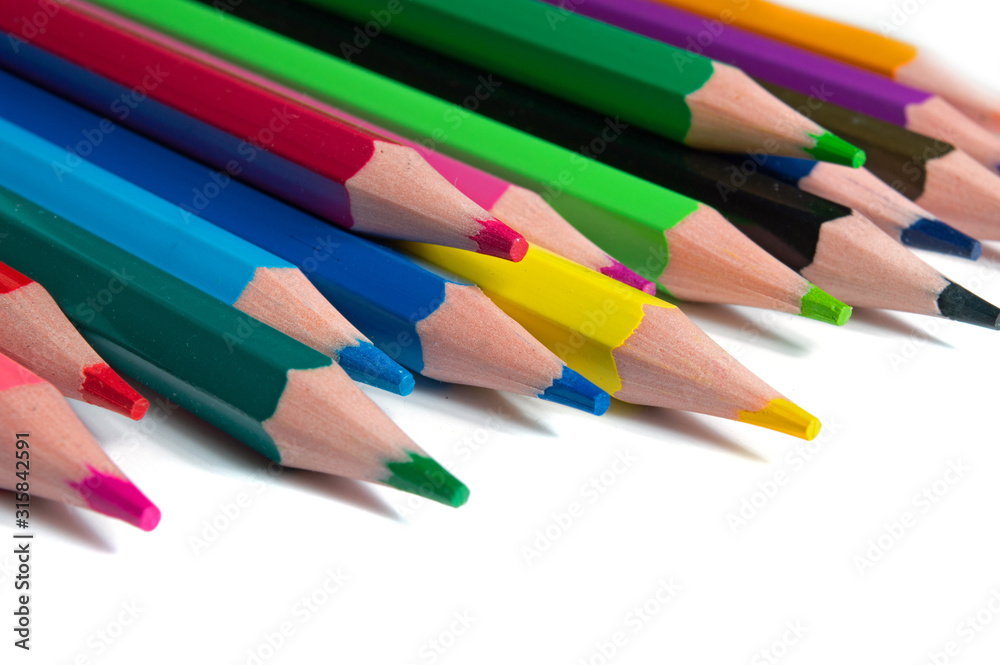 multicolored pencils on a white background. multicolored pencils on a white background.