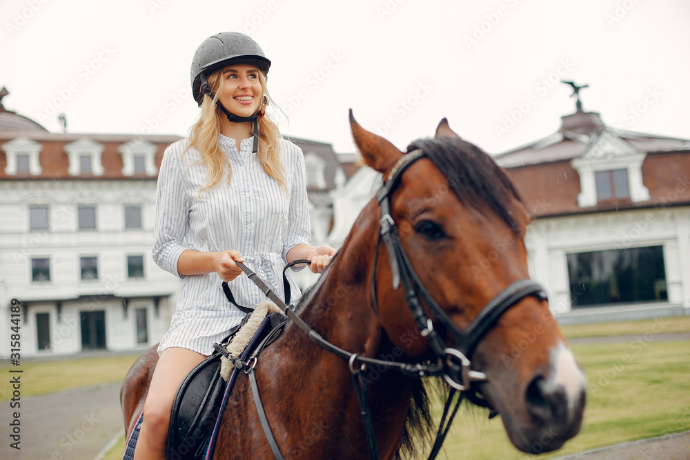 Woman standing with a horse. Lady in a white dress