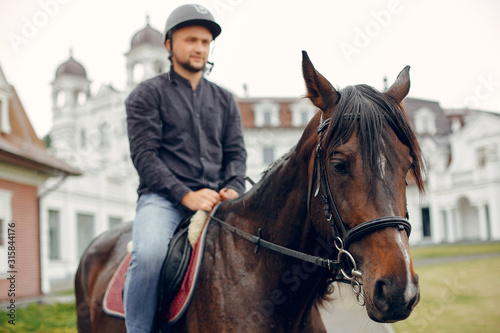 Horse theme. Businessman with a horse. Man in a black shirt