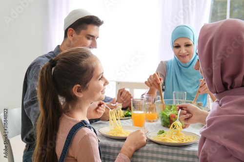 Muslim family having dinner at home