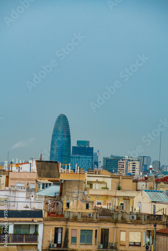 BARCELONA, SPAIN - January 23, 2019: Casa Mila is the famous art work by an artist Antoni Gaudi. Gaudi was a Spanish architect who designed many buildings in Barcelona, Spain... photo