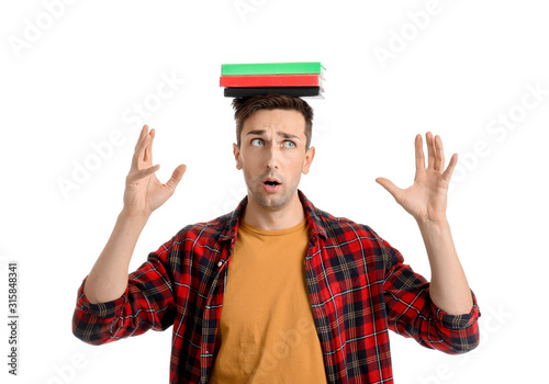 Worried young man with book...