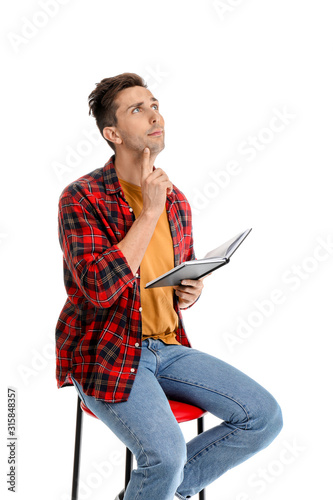 Thoughtful young man with b...