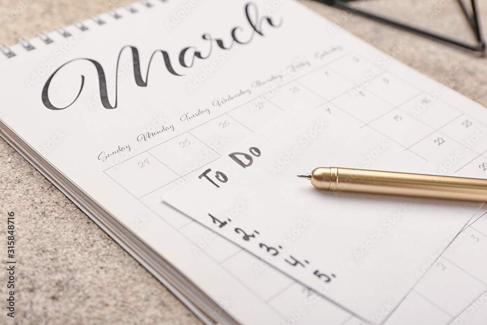 Empty to do list with calendar on table, closeup Empty to do list with calendar on table, closeup
