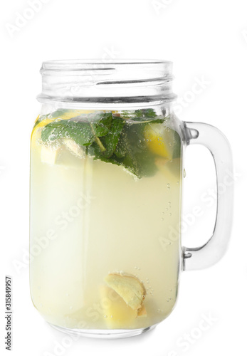 Mason jar of tasty ginger lemonade on white background