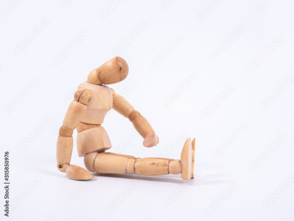 The wooden dummy sits on white background The wooden dummy sits on white background