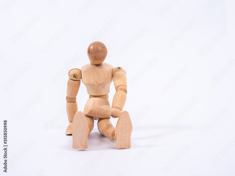 The wooden dummy sits on white background The wooden dummy sits on white background