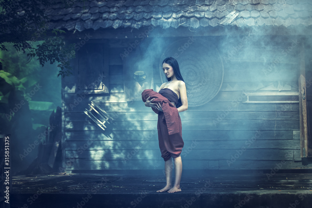 Legend of Mae Nak Phra Khanong. Thai Ghost concept, Horror scene of scary woman with her baby ghost Legend of Mae Nak Phra Khanong. Thai Ghost concept, Horror scene of scary woman with her baby ghost