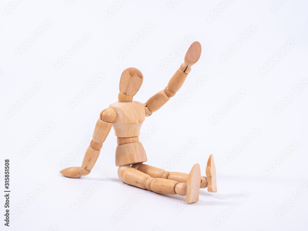 The wooden dummy sits on white background The wooden dummy sits on white background