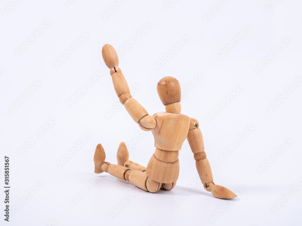 The wooden dummy sits on white background The wooden dummy sits on white background