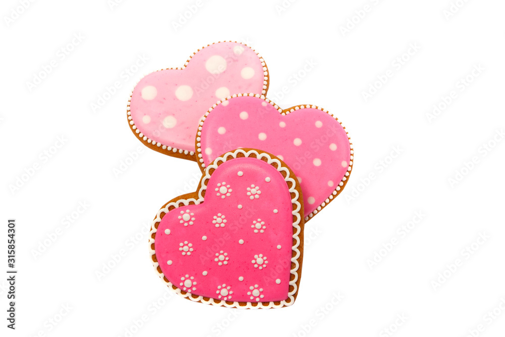 background from pink cookies heart shaped with different patterns, isolated on white