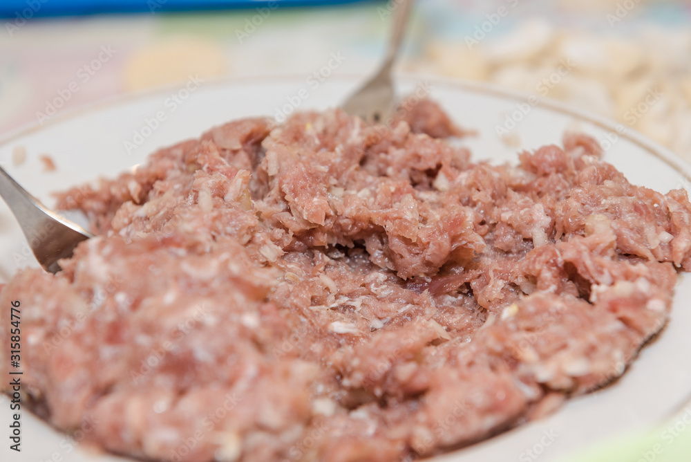 minced pork meat closeup. minced meat background. minced pork meat closeup. minced meat background.
