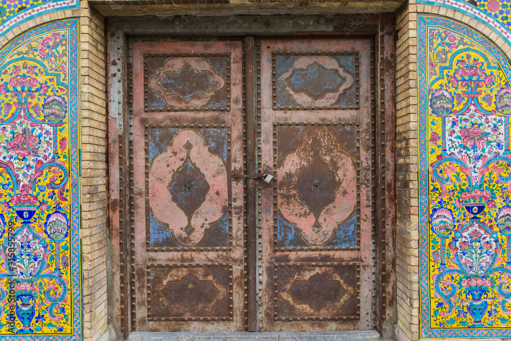 mosaic authentic oriental carvings door in Golestan Palace, Tehran, Iran