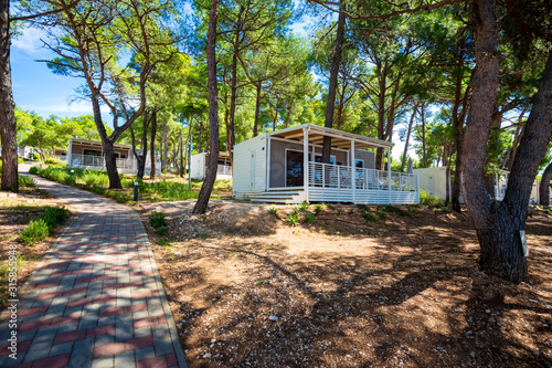 Fototapeta Naklejka Na Ścianę i Meble -  wooden camping houses on the shore, Losinj island, Croatia.
