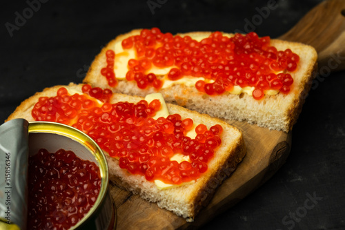 sandwich with butter and red caviar