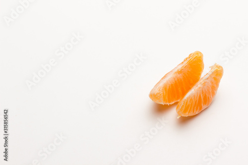 Tangerine orange-skinned sweet fruit of the citrus family.