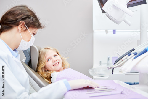 Dentist or physician assistant treats child