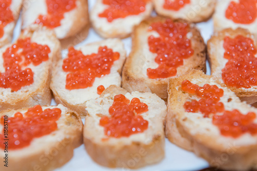caviar with butter background. red caviar with butter close-up.