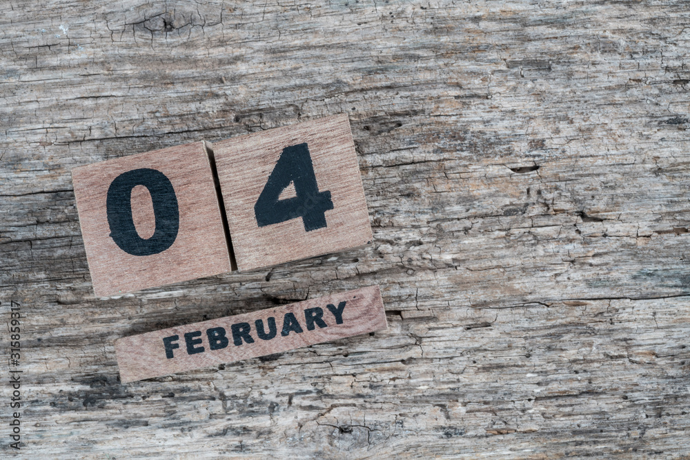 cube calendar for february on wooden background with copy space cube calendar for february on wooden background with copy space