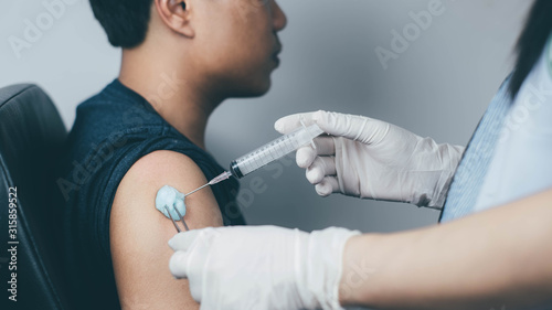 The doctor carried a syringe to treat and gave the patient a Sein measurement.Vaccination concept. Healthcare  hospital and medical diagnostics.