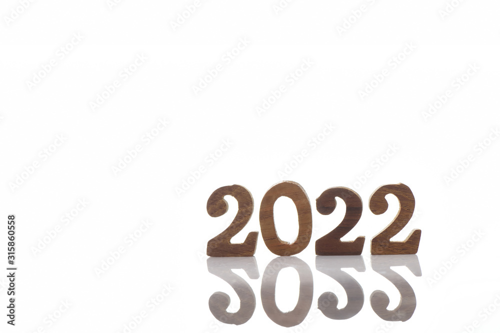 Wooden 2022 isolation on white background, happy new year concept and happiness time to change idea Wooden 2022 isolation on white background, happy new year concept and happiness time to change idea