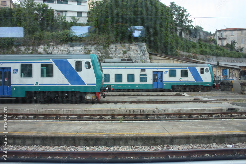 Italian regional train on the tracks near the station Italian regional train on the tracks near the station