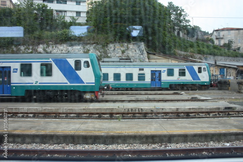 Italian regional train on the tracks near the station