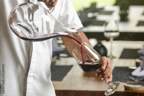 Wine decanter, wineglasses and red wine. Decanting wine ensures that the sediment stays in the bottle and you get a nice clear wine and second and more everyday reason to decant is to aerate the wine.